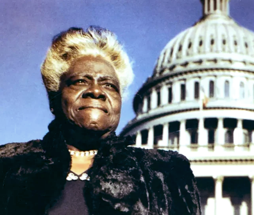 Mary McLeod Bethune standing in front of the United States Capitol Dome in Washington, D.C., 1949. This photograph was originally published as the cover photo of the April 1949 issue of Ebony Magazine.