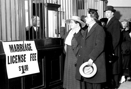 Unknown subjects waiting in line at the Marriage Bureau, photographed between c. 1915-c.1920